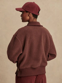 Back view of Varley Roselle fleece in Deep Mahogany with relaxed fit and ribbed cuffs