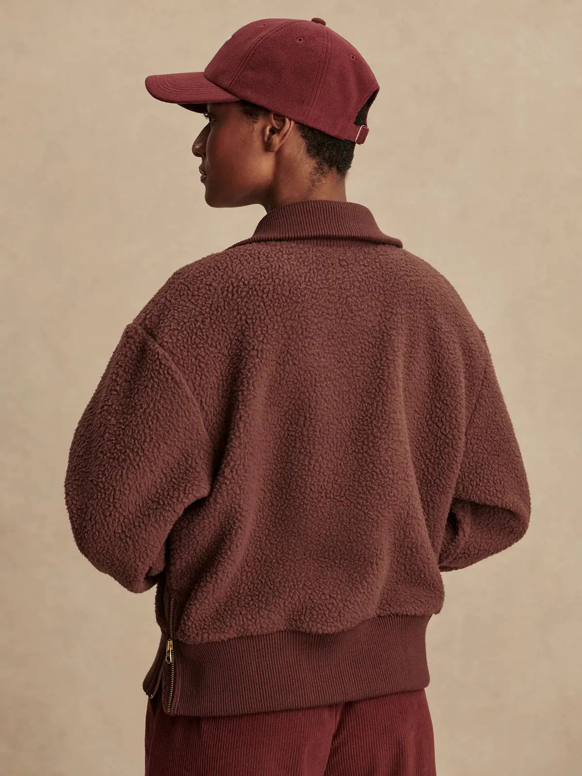 Back view of Varley Roselle fleece in Deep Mahogany with relaxed fit and ribbed cuffs