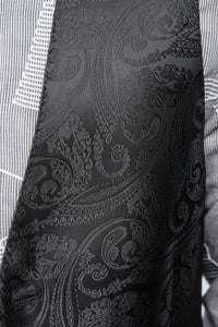 Close-up of all-black paisley pattern