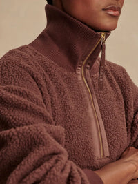 Close-up of luxe sateen trim on Varley Roselle Half-Zip Fleece – Deep Mahogany