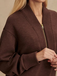 Close-up of chunky rib knit detailing on V-neckline and cuffs