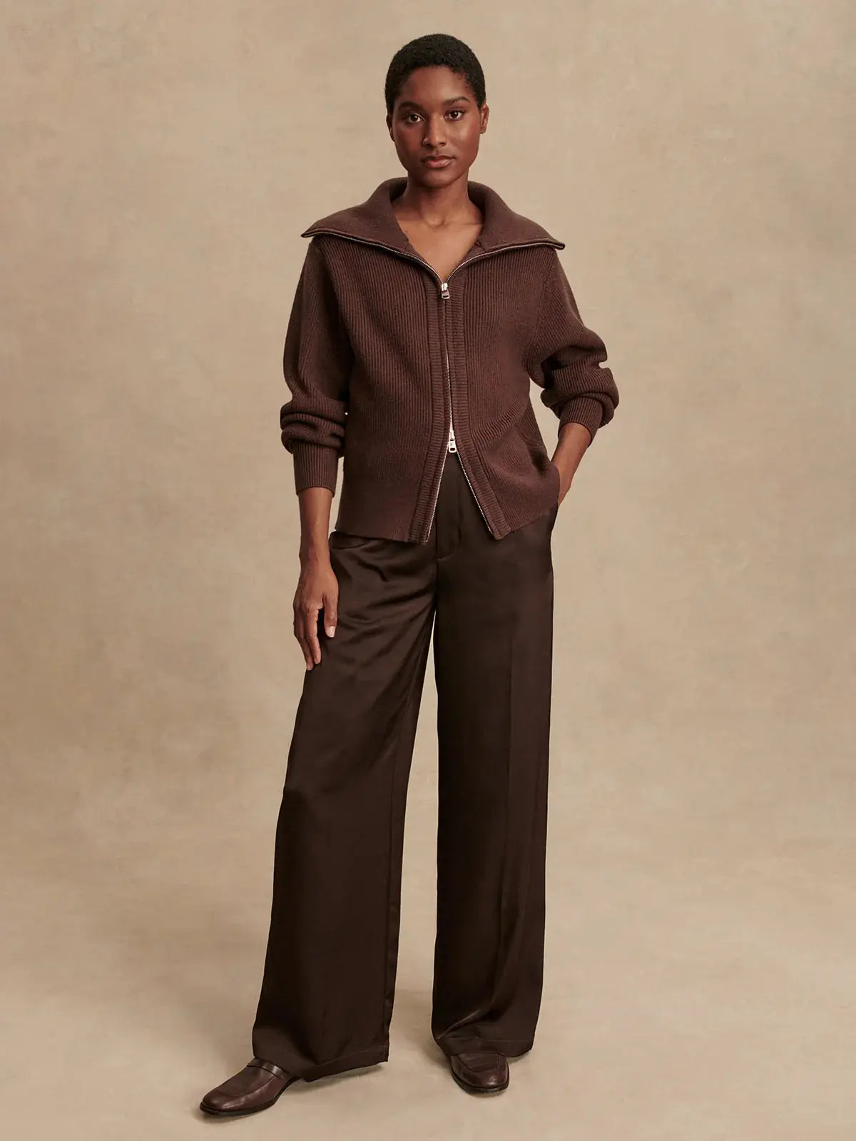 Model wearing Enrico Knit Jacket in Coffee Bean, styled for fall athleisure