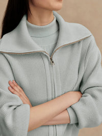 Close-up of fold-back collar and double-ended zip on Enrico Knit Jacket