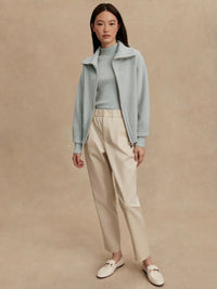 Model wearing Enrico Knit Jacket in Winter Sky, styled for fall athleisure