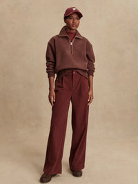 Model wearing Varley Roselle fleece in Deep Mahogany, styled with athleisure pants