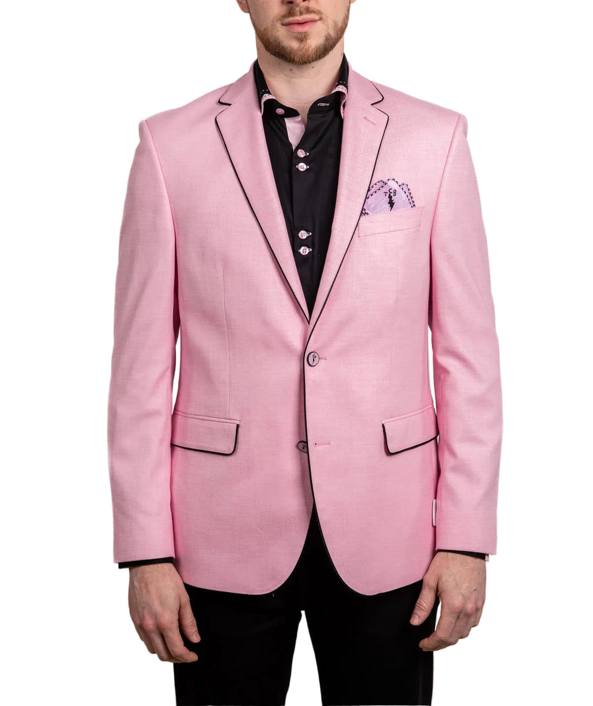 Man wearing a pink blazer over a black shirt with a white background