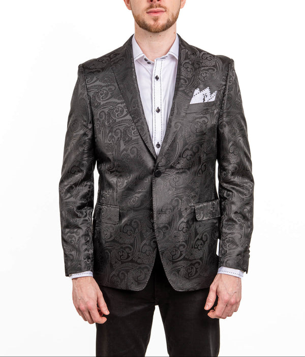 Man wearing a patterned gray blazer on a white background