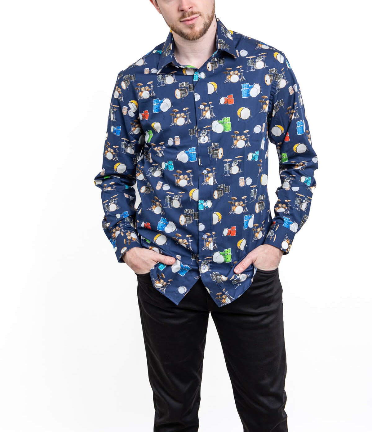 Man wearing a patterned shirt with a white background with drums
