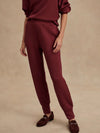 Front view of Varley Slim Cuff Pant 25" in New Maroon, slim tailored fit with cuffed hem