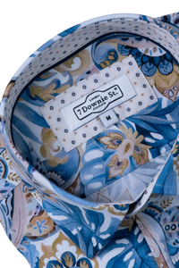 Blue patterned fabric with a label on a white background