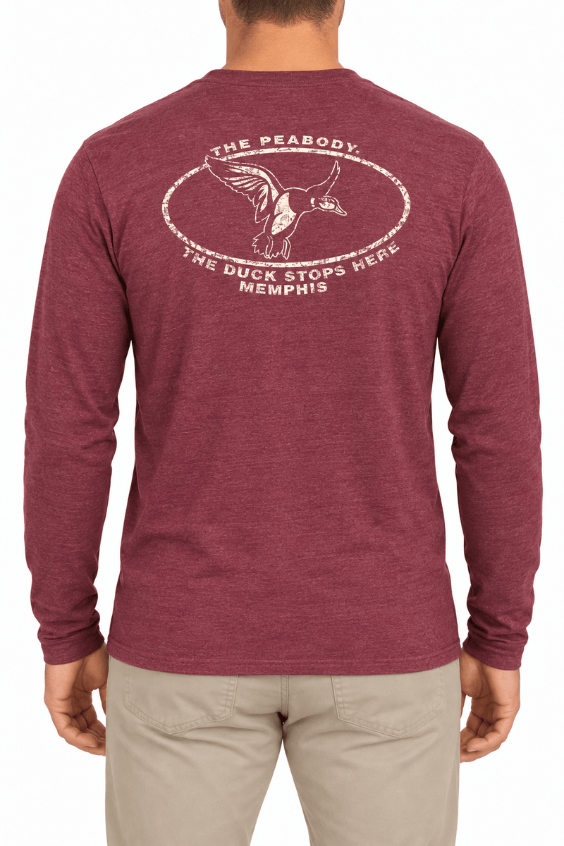 Back of burgundy Peabody tee with distressed cream duck graphic and The Duck Stops Here lettering