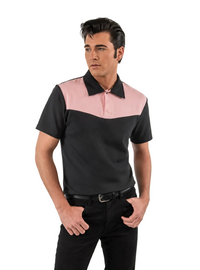A man modeling a short-sleeve polo shirt with a color-blocked design featuring a black body and collar with a light pink yoke, paired with black pants against a light gray studio background.