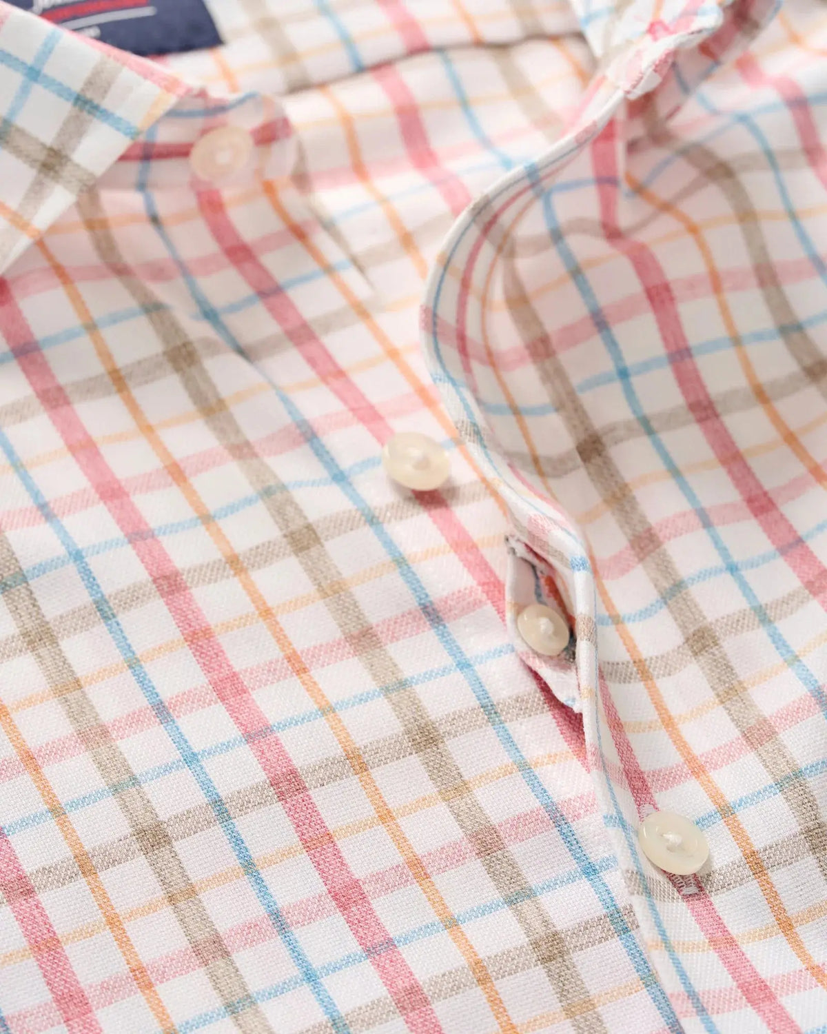 Close-up of hidden button-down spread collar