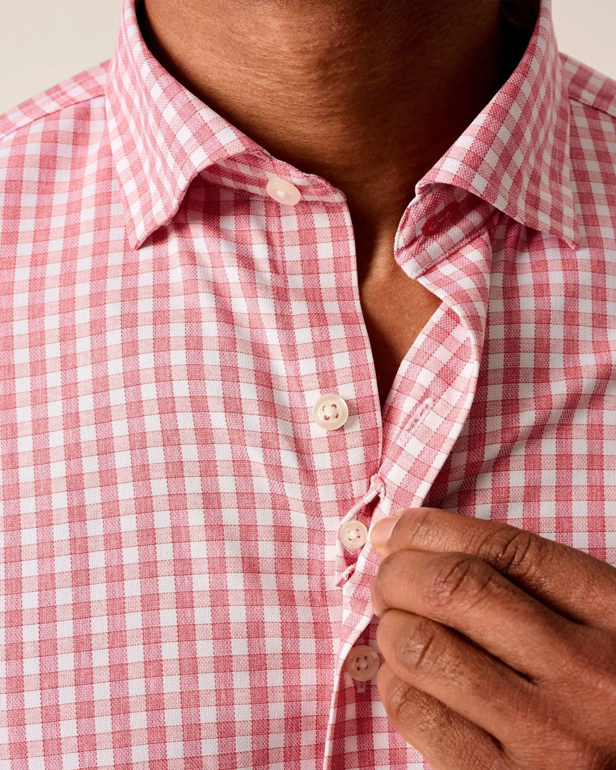 Close-up of hidden button-down collar and French front placket