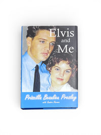 Book titled 'Elvis and Me' featuring a photo of a man and a young girl on the cover.