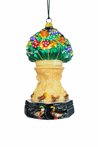 Decorative ornament with floral design and birds on a white background