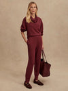 Model wearing Slim Cuff Pant 25" in New Maroon with DoubleSoft® sweater