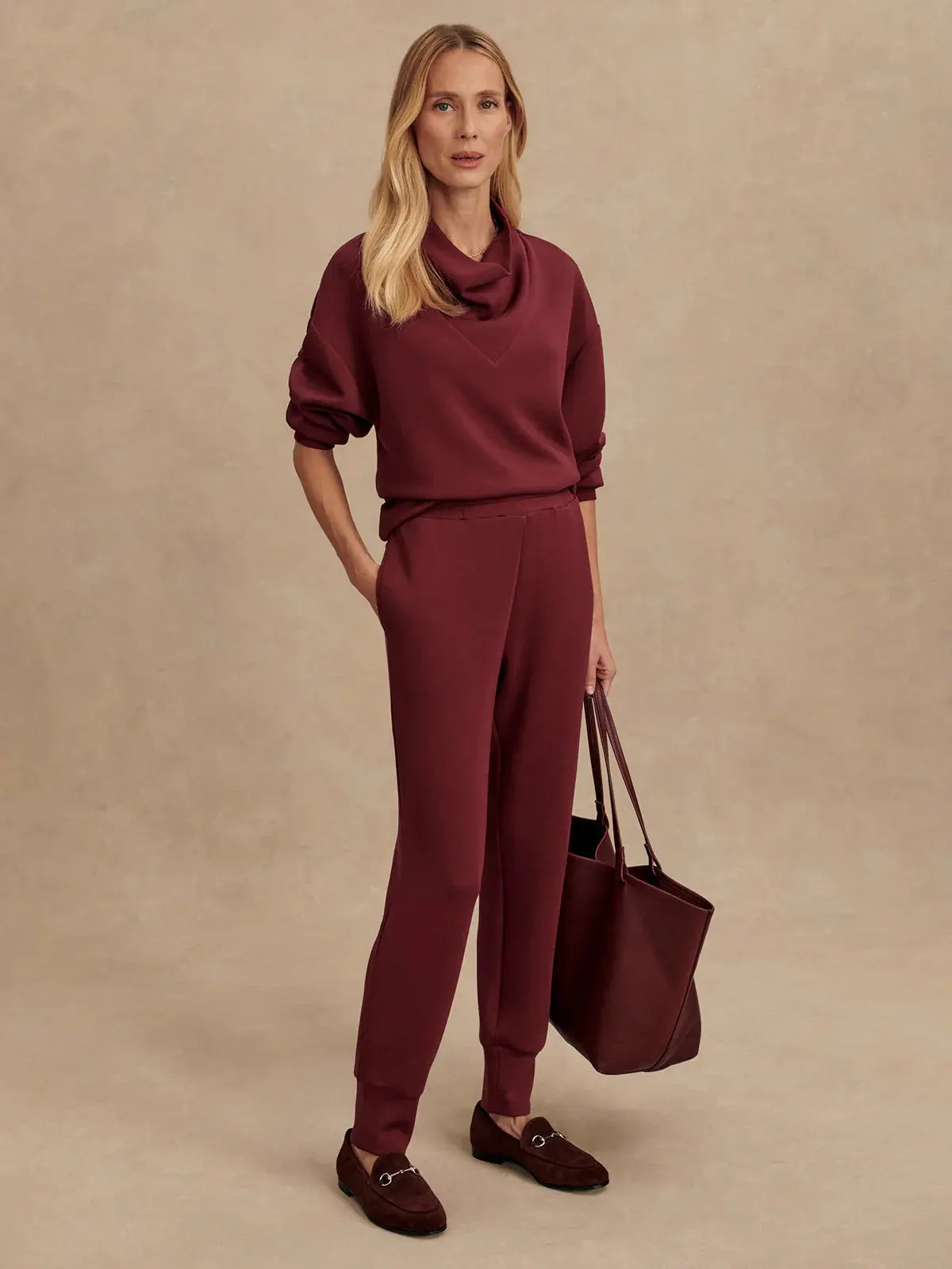 Model wearing Slim Cuff Pant 25" in New Maroon with DoubleSoft® sweater