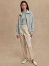 Model wearing Enrico Knit Jacket in Winter Sky, styled for fall athleisure