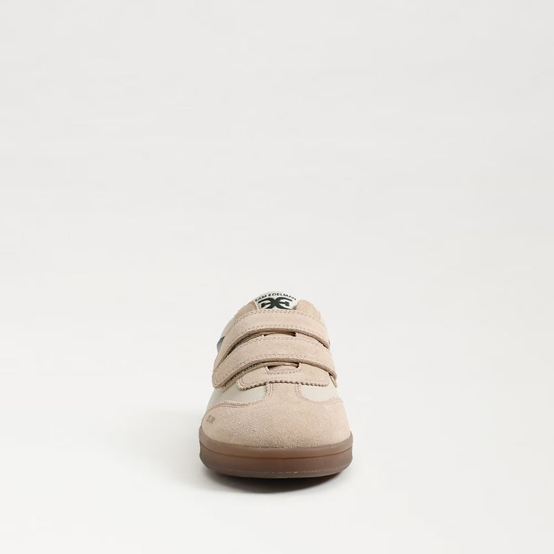 Front angle of ivory leather Talia sneaker showing rounded toe and sleek contrast detailing