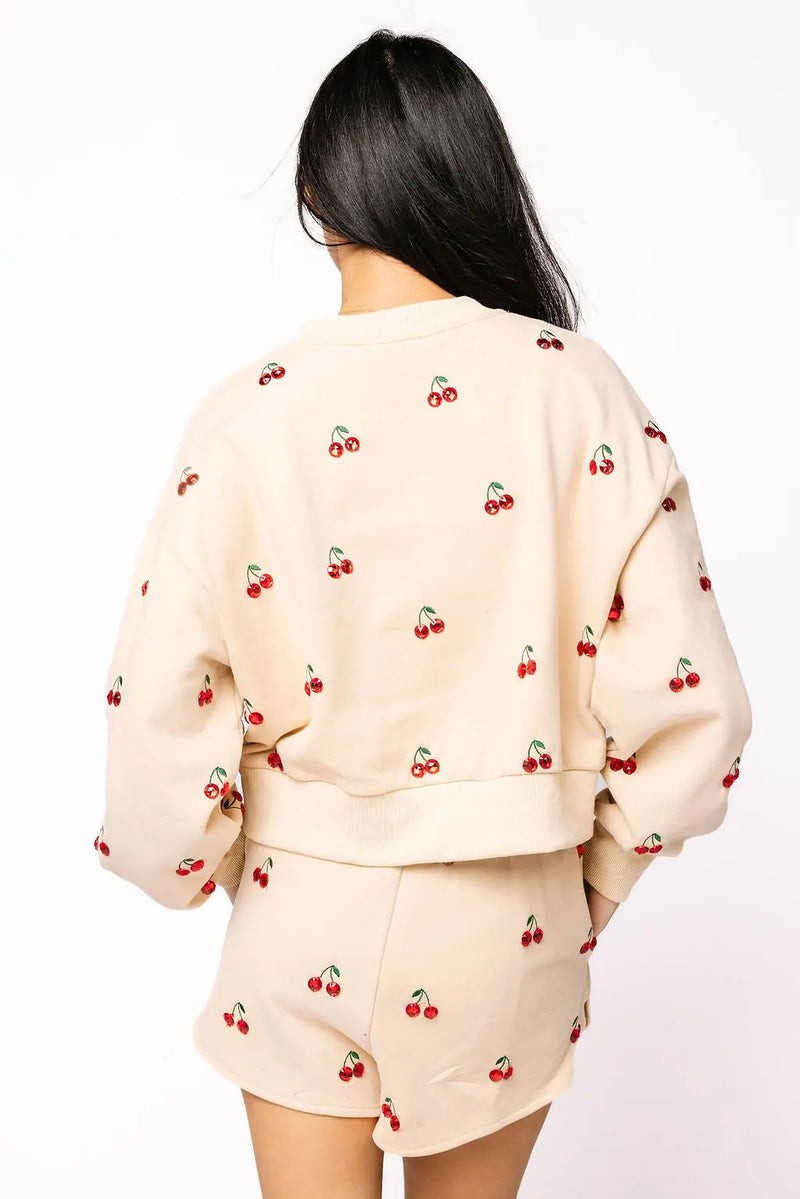 Back view of Queen of Sparkles jeweled cherry sweatshirt