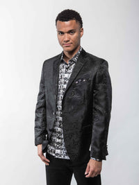 Angled view of the Lansky Bros. Limited Edition Wedding Jacket, highlighting the black paisley pattern and Clothier to the King label.