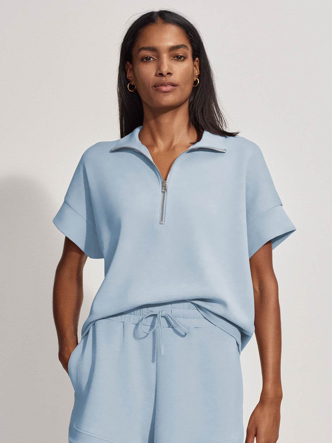 Varley Ritchie Short Sleeve Top in Cashmere Blue with mock neck and half-zip