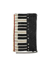 Mary Frances piano-shaped crossbody bag with white, black, and gold hand-laid beads and removable chain strap.